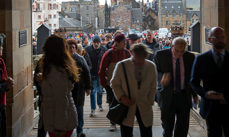 Visitors coming in over the drawbridge