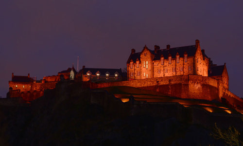 The castle lit orange
